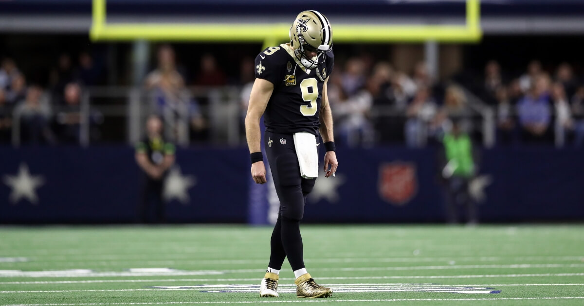 Drew Brees of the New Orleans Saints walks off the field during Thursday night's game against the Dallas Cowboys at AT&T Stadium.