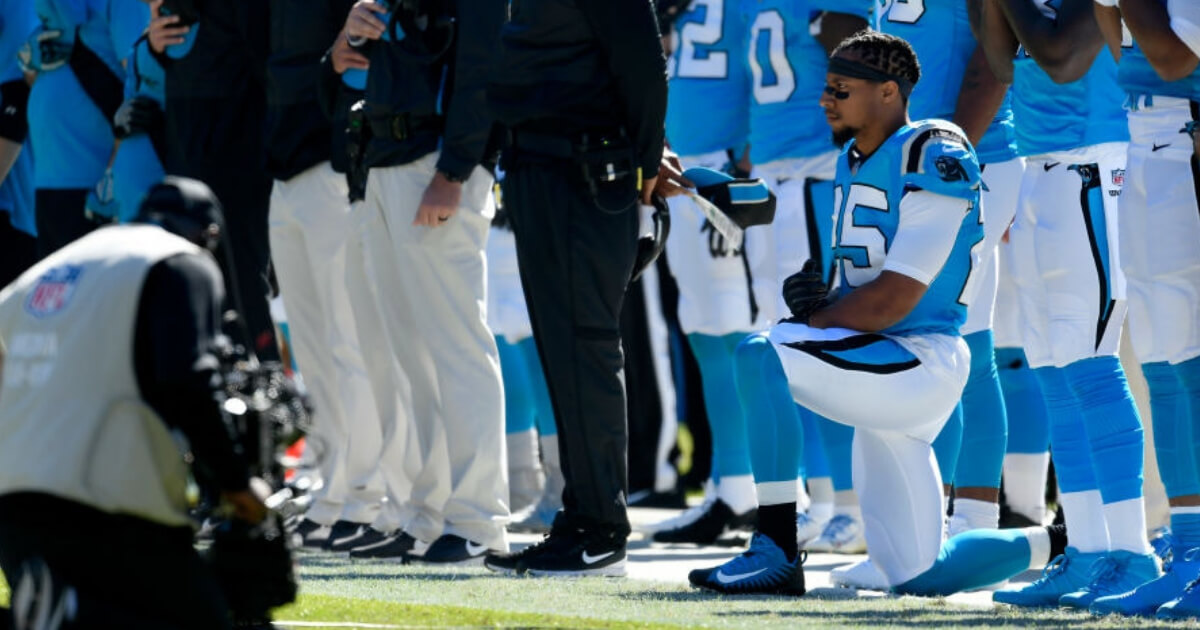 Eric Reid of the Carolina Panthers kneels during the national anthem prior to the team's Oct. 28 game against Baltimore.