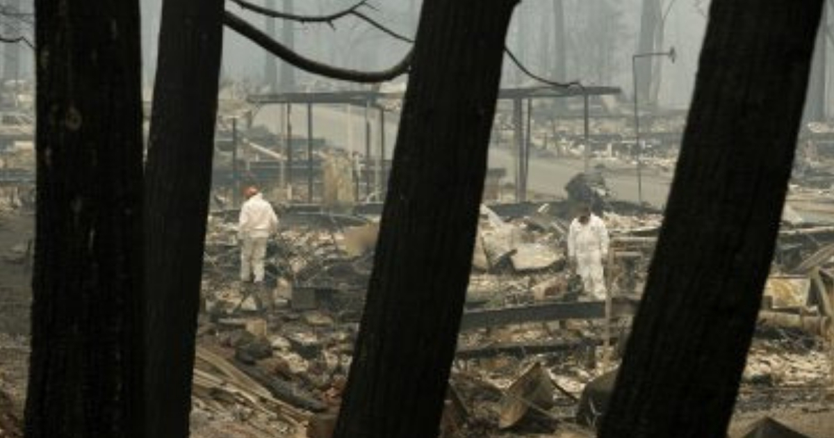 Rescue workers search for human remains Tuesday at a trailer park destroyed by the Camp Fire in Paradise, California.