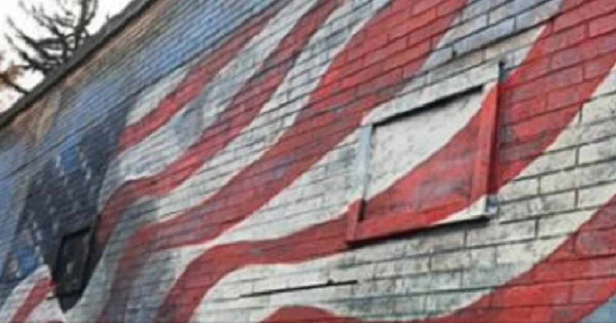 An American flag mural was marred by graffiti on Election Day in New Palrz, New York.