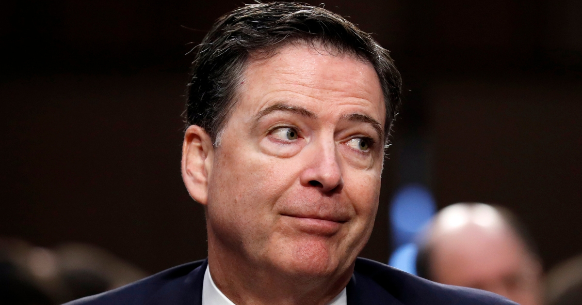 Former FBI Director James Comey reacts during a Senate Intelligence Committee hearing on Capitol Hill in Washington.