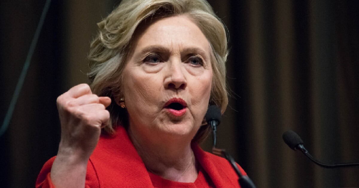 Hillary Clinton clutches her fist in a file photo from 2016.
