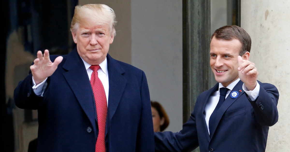 French President Emmanuel Macron welcomes U.S. President Donald Trump prior to their meeting at the Elysee Presidential Palace in Paris on Saturday.