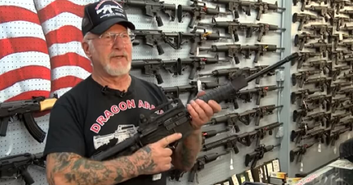 Mel Bernstein holds a rifle in his Dragaon Arms gun shop outside Colorado Springs, Colorado.