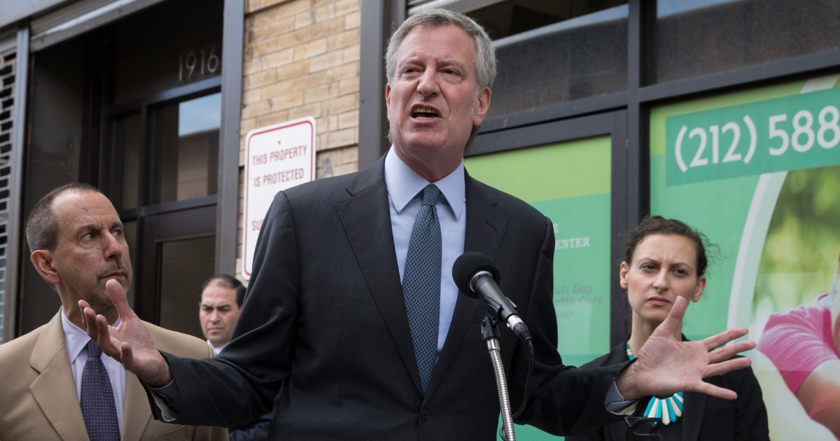 New York City Mayor Bill de Blasio speaks to reporters after touring the Cayuga Centers facility, which is holding immigrant children separated from their parents, after taking a tour of the facility, June 20, 2018, in New York.