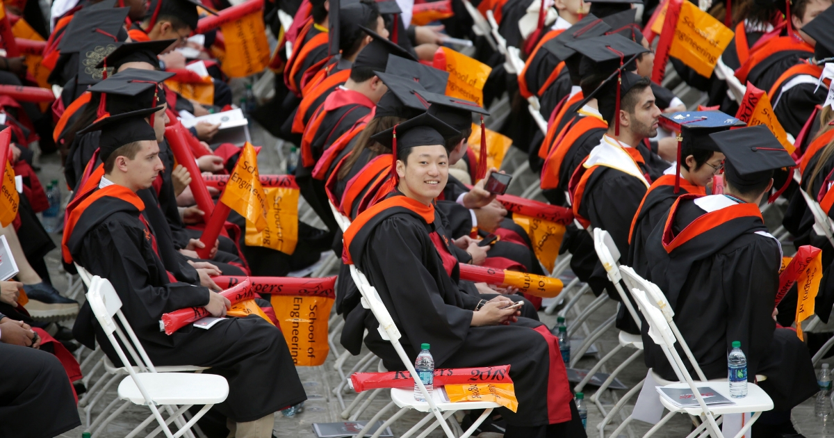 New graduates participate in a Rutgers University graduation ceremony in Piscataway Township, N.J., Sunday, May 13, 2018. Family and friends watched as over 18,000 graduates received their degrees on Mother's Day.