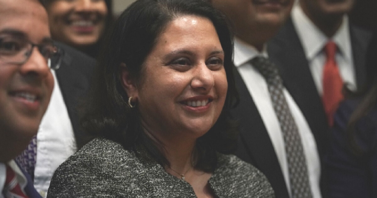 Noemi Rao grins during Trump's announcement Tuesday.