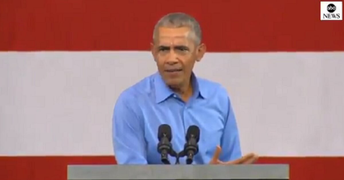 Former President Barack Obama at a speaker's podium.