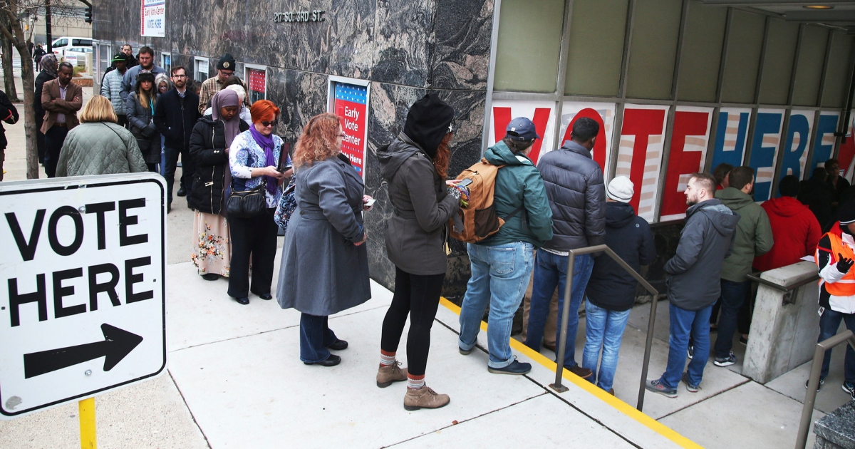 People line up to vote on the last day of early voting at the Minneapolis Early Vote Center Monday, Nov. 5, 2018, in Minneapolis.
