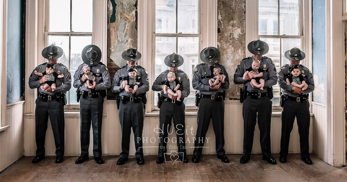 Seven officers with their seven babies.
