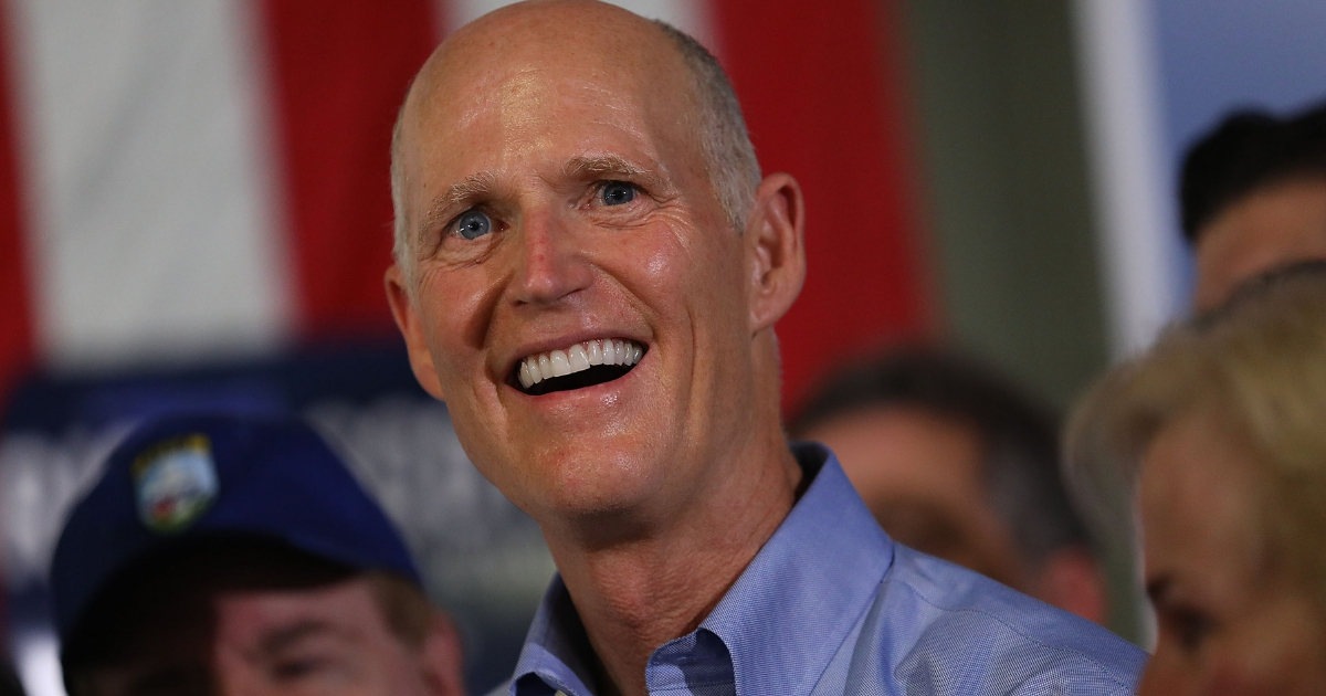 Florida governor and Republican senatorial candidate Rick Scott addresses the crowd as he attends a Get out the Vote Rally at AmeriKooler on Nov. 5, 2018, in Hialeah, Florida.