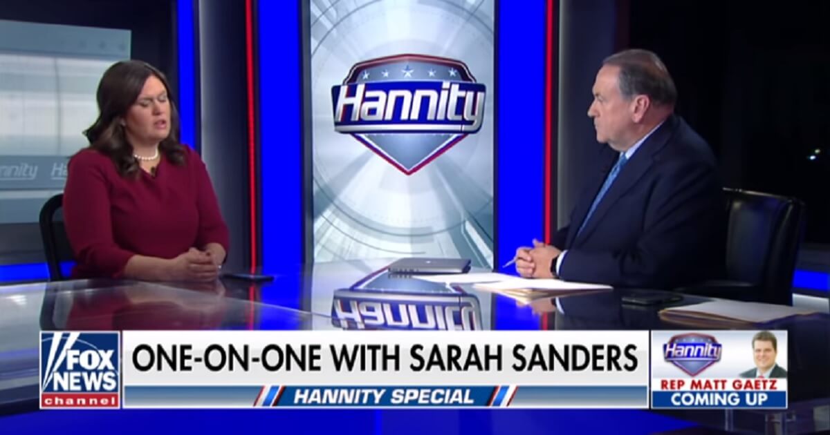 White House press secretary Sarah Sanders is interviewed by her father, former Arkansas Gov. Mike Huckabee, for Fox News on Friday night.