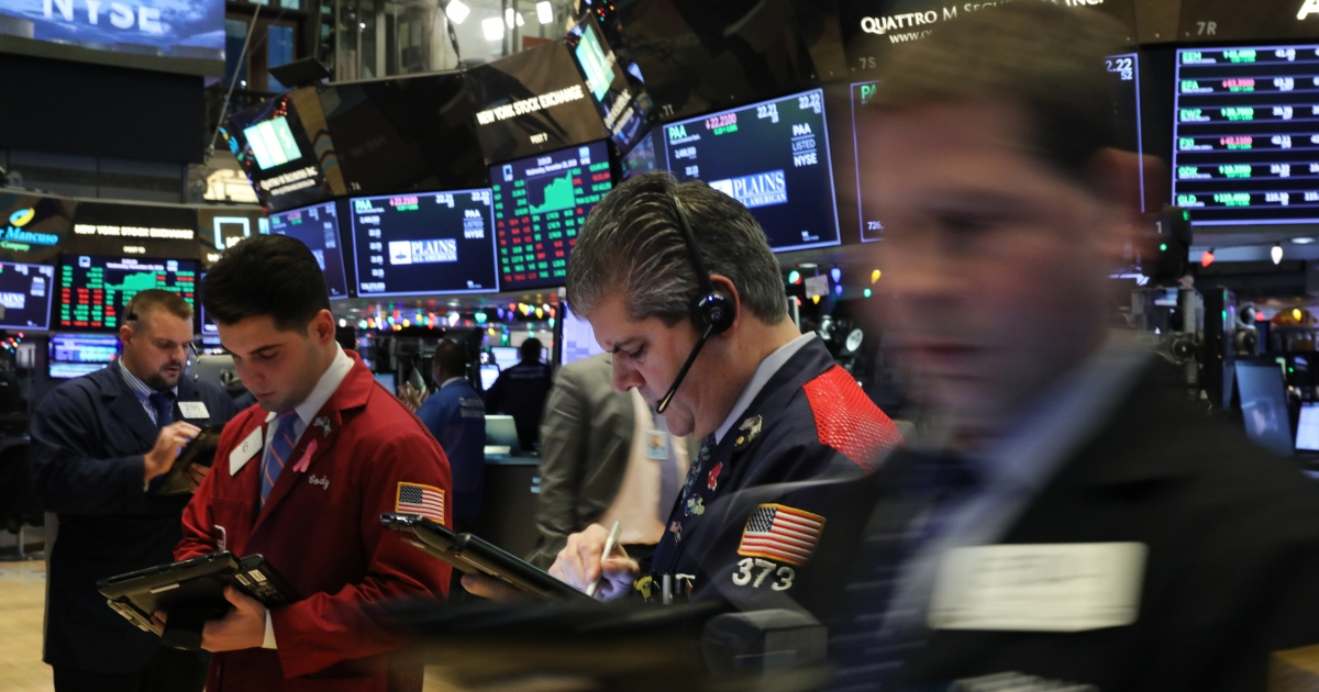 Traders work on the floor of the New York Stock Exchange on Wednesday.