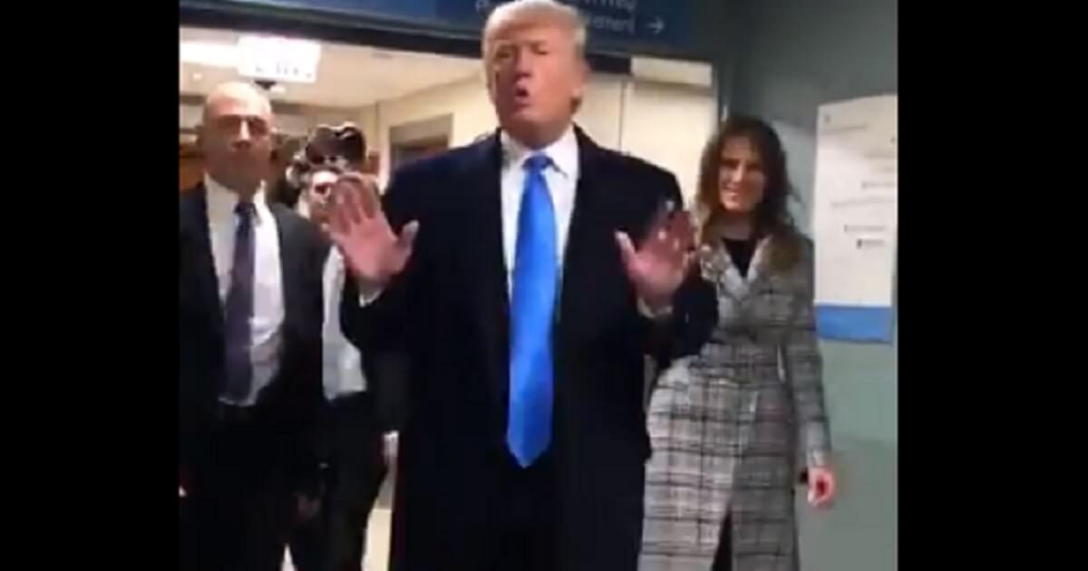 President Donald Trump and first lady Melania Trump greeting hospital personnel.