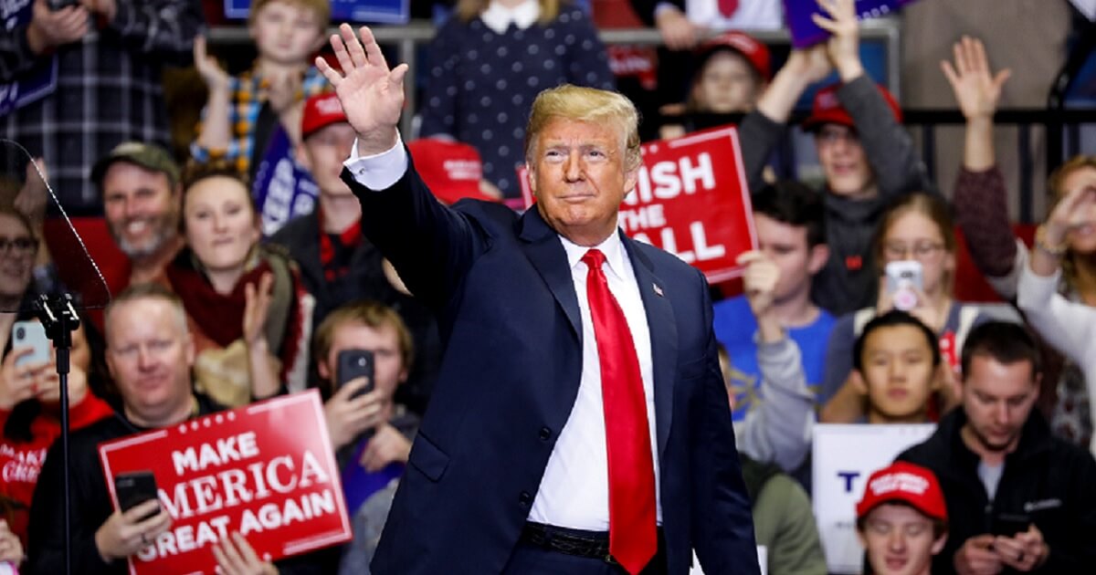 President Donald Trump waves to supporters during a rally in Indiana Monday for Republican Senate candidate Mike Braun.