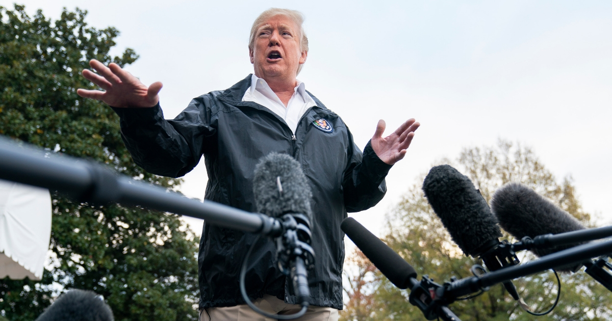 President Donald Trump answers questions Saturday before departing the White House for California, where he is scheduled to view damage from the state's wildfires.
