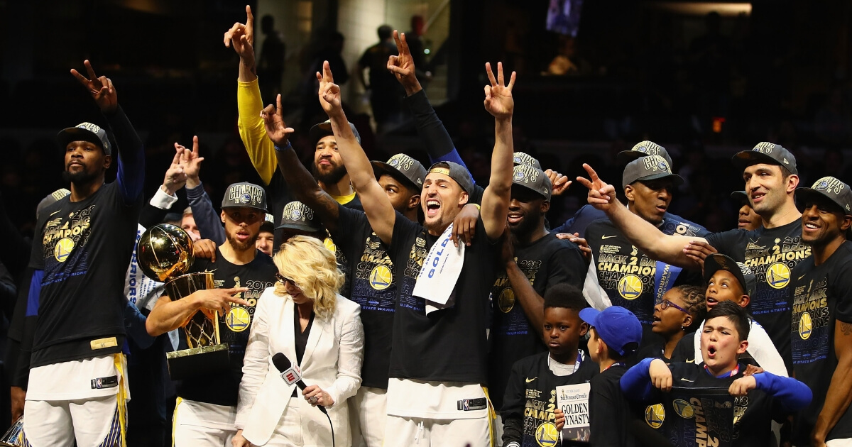 The Golden State Warriors celebrate June 8 after defeating the Cleveland Cavaliers in Game 4 to win their third NBA championship in four years.
