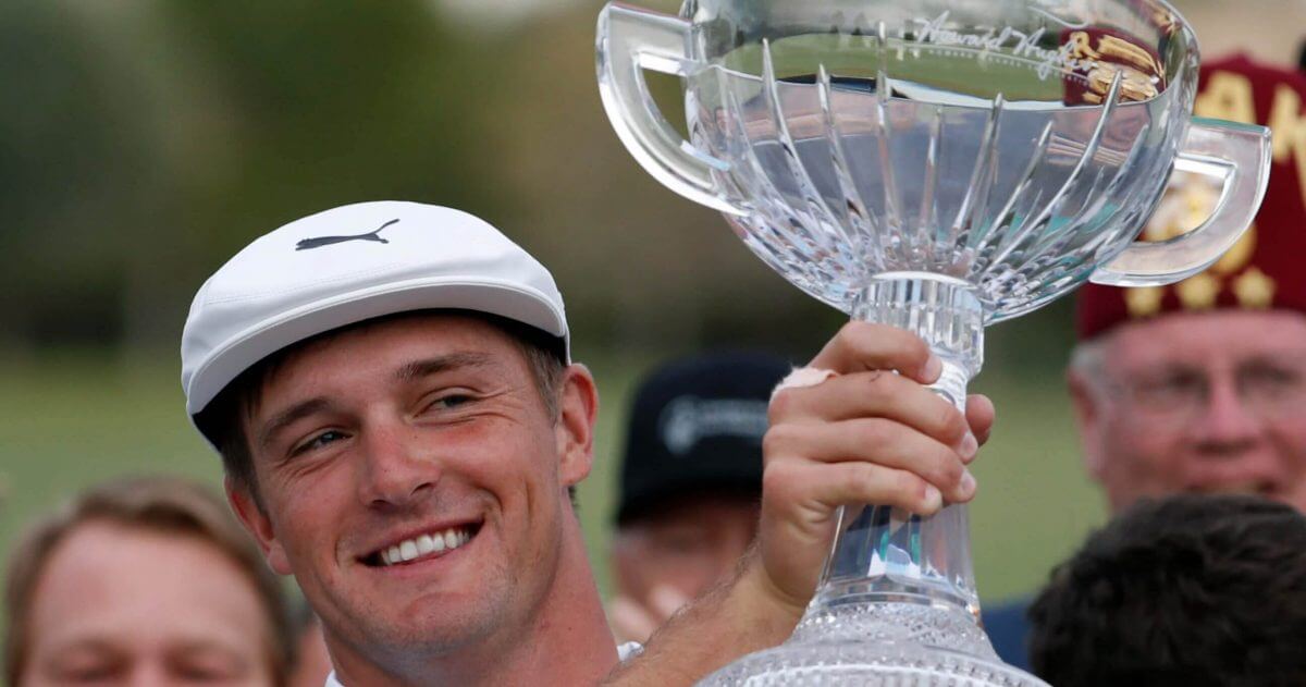 Bryson DeChambeau holds up the trophy after winning the PGA Tour's Shriners Hospitals for Children Open on Sunday in Las Vegas.