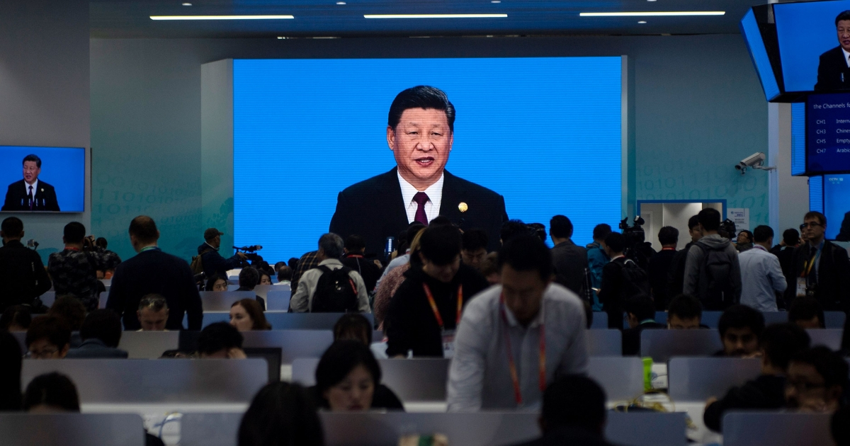 China's President Xi Jinping is seen on a big screen in the media center.