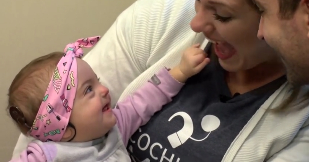 Little girl hears for first time.