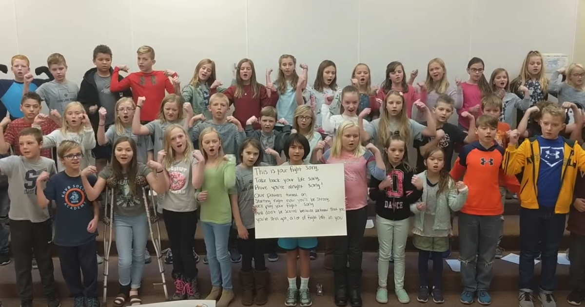 Kids singing for classmate