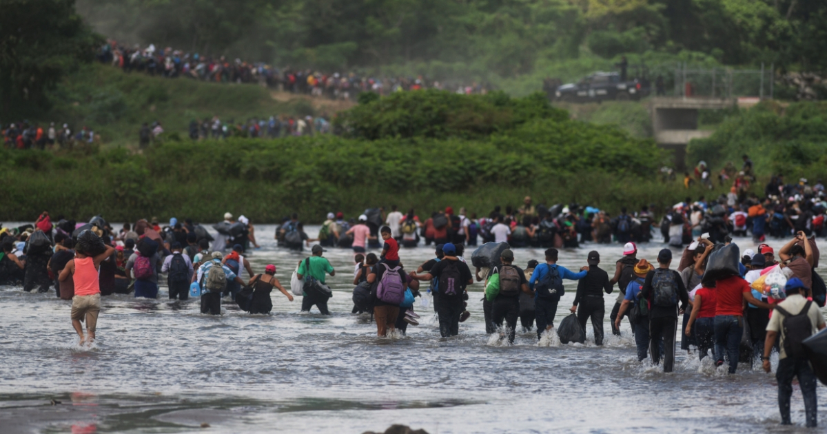 Salvadorean migrants heading in a caravan to the U.S., cross the Suchiate River to Mexico, as seen from Ciudad Tecun Uman, Guatemala, on Nov. 2, 2018.