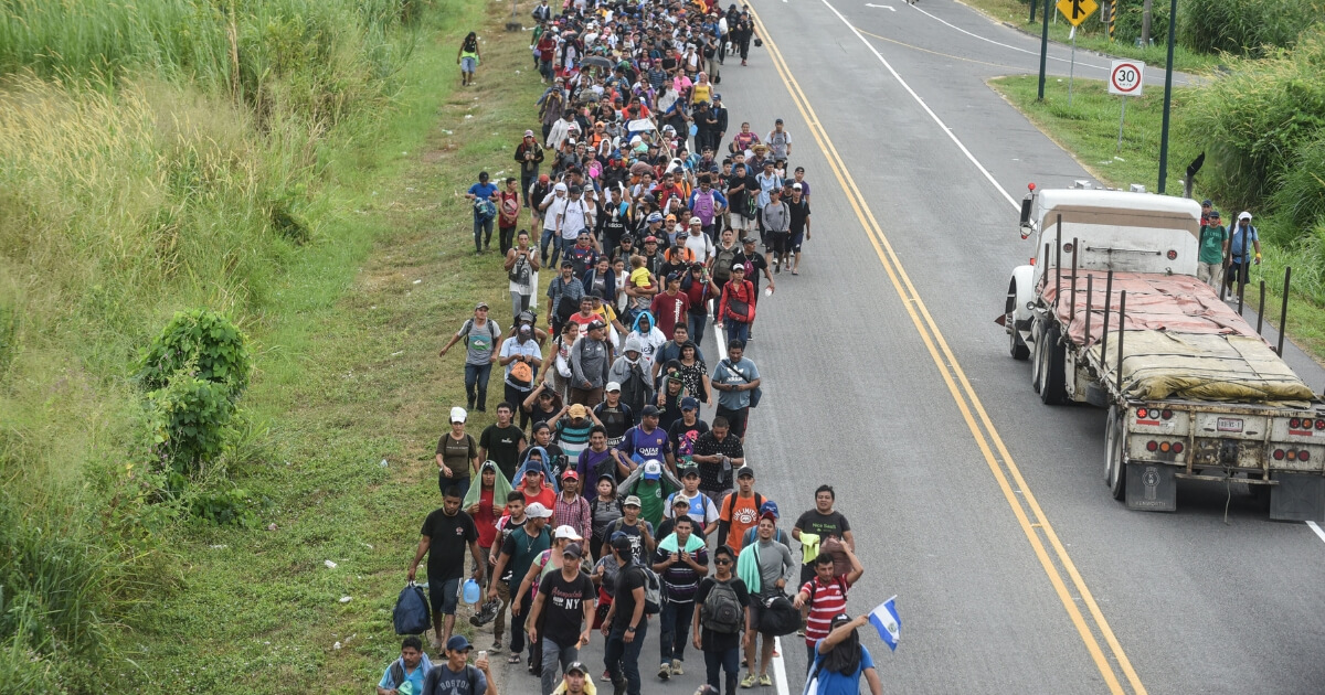 Salvadorean migrants heading in a caravan to the US, walk alongside the route, between Ciudad Hidalgo and Tapachula in Mexico on Nov. 2, 2018.
