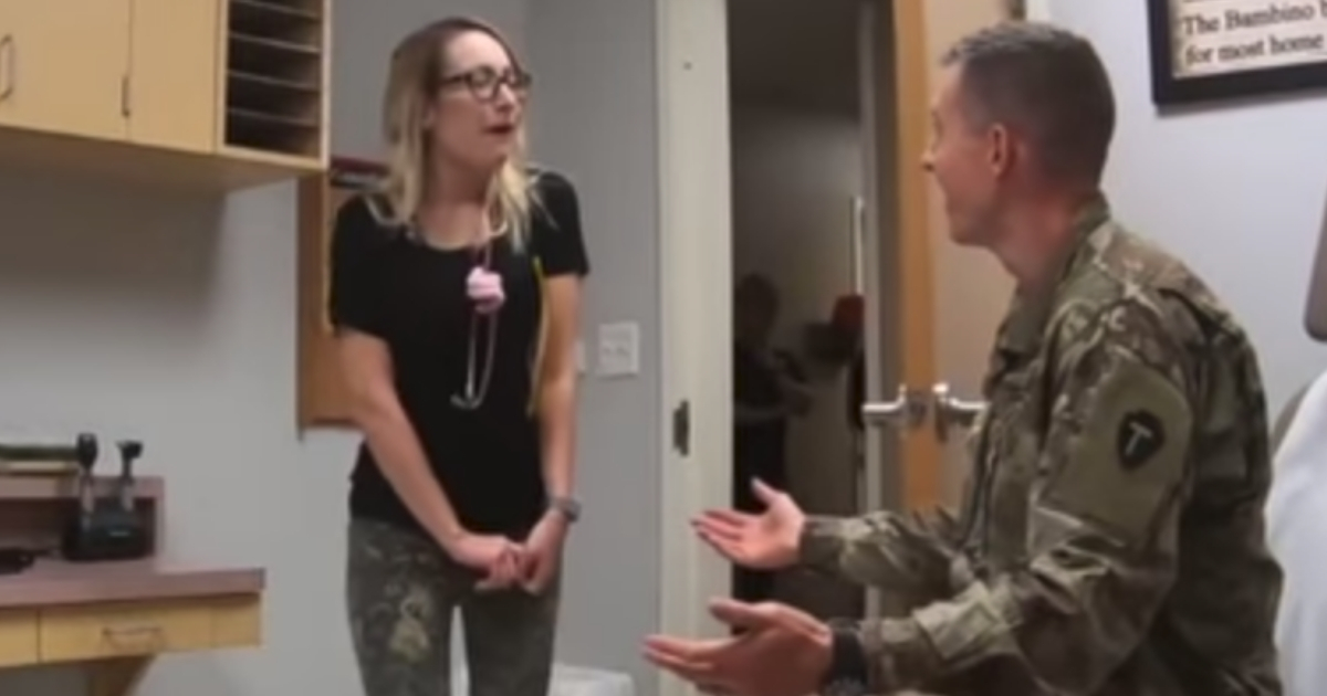 A doctor is surprised by her military husband.