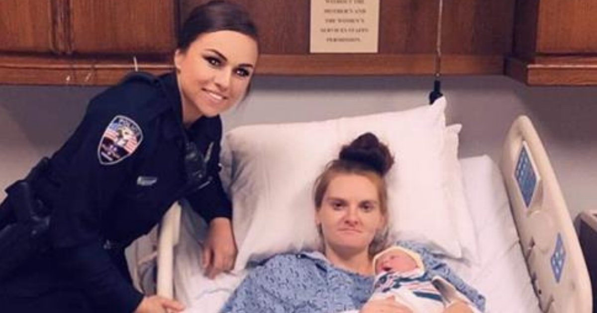 A police officer with the mother and baby she helped deliver.