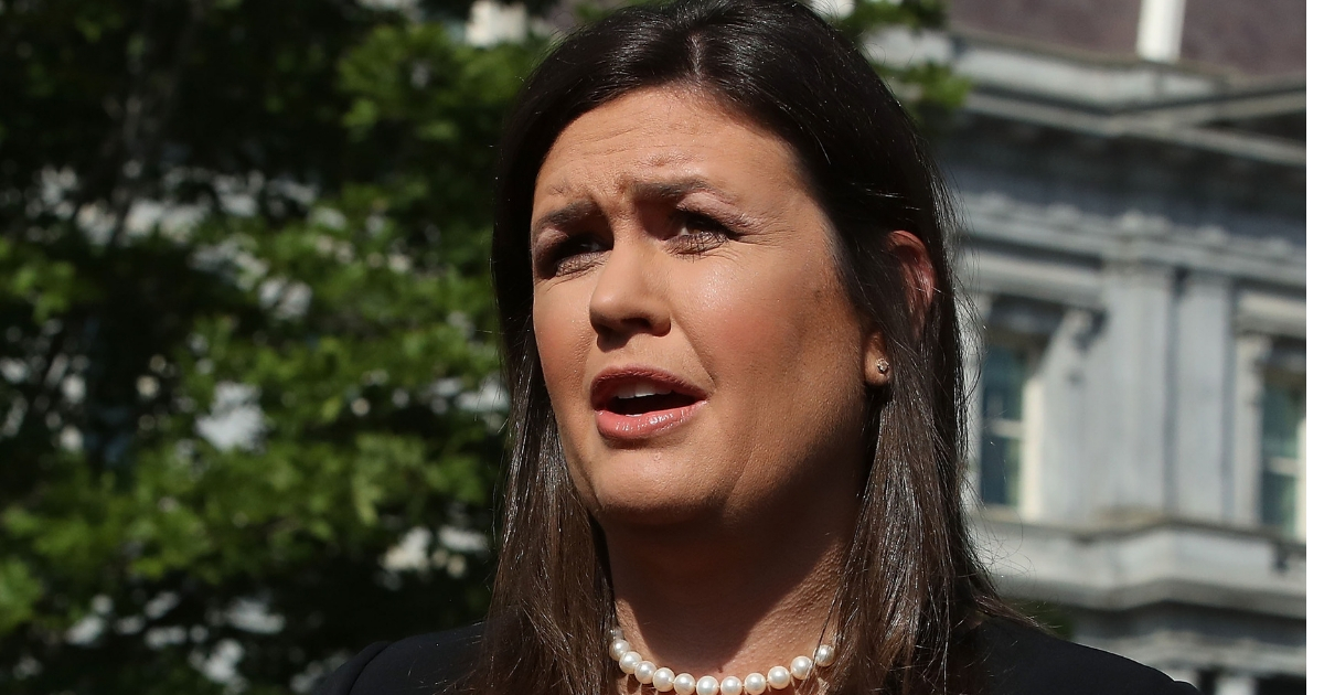 White House press secretary Sarah Huckabee Sanders speaks to the media in front of the West Wing of the White House.
