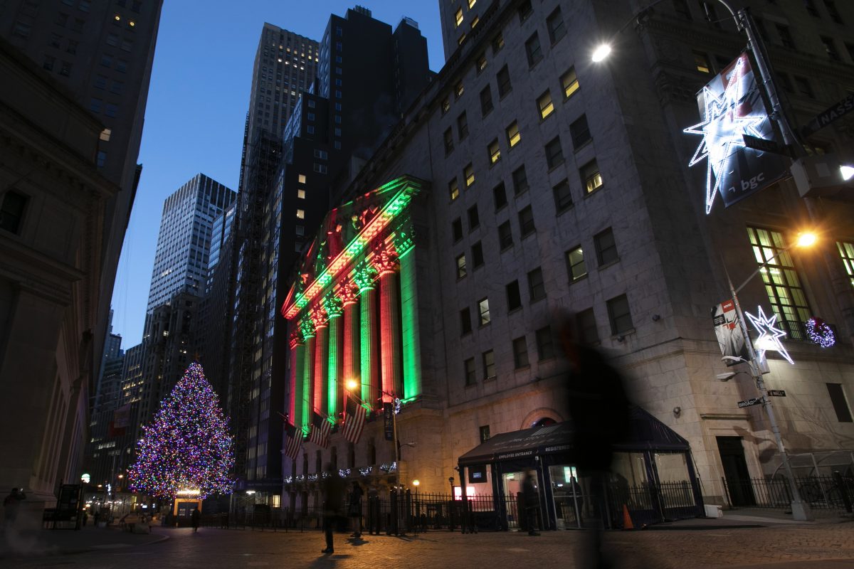 In this Dec. 11, 2018, file photo, the New York Stock Exchange is bathed in holiday light, in New York. U.S. stocks are slightly lower Thursday morning, Dec. 20, a day after another big plunge rocked markets around the world. Asian and European indexes suffered bigger losses. Stocks have tumbled as investors grow increasingly worried the U.S. could slip into a recession in the next few years