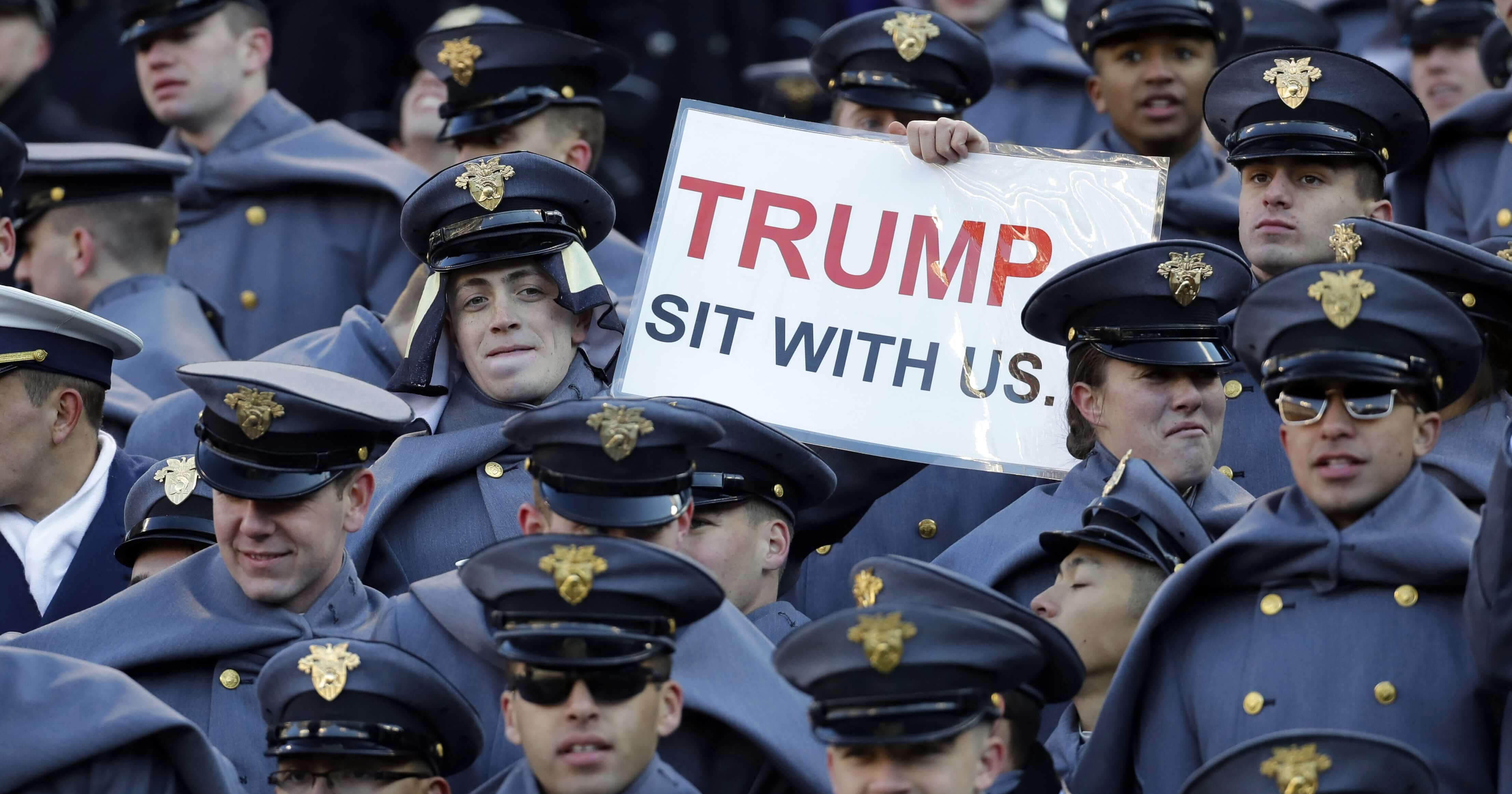 An Army cadet displays a sign for then President-elect Donald Trump during the 2016 Army-Navy game in Baltimore.