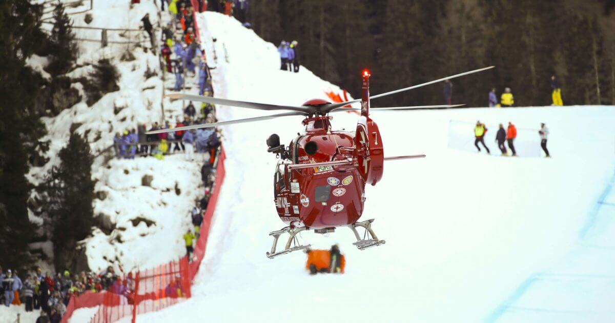 A rescue helicopter takes off with Switzerland's Marc Gisin after the skier crashed on the course during a men's World Cup downhill in Val Gardena, Italy, on Saturday.