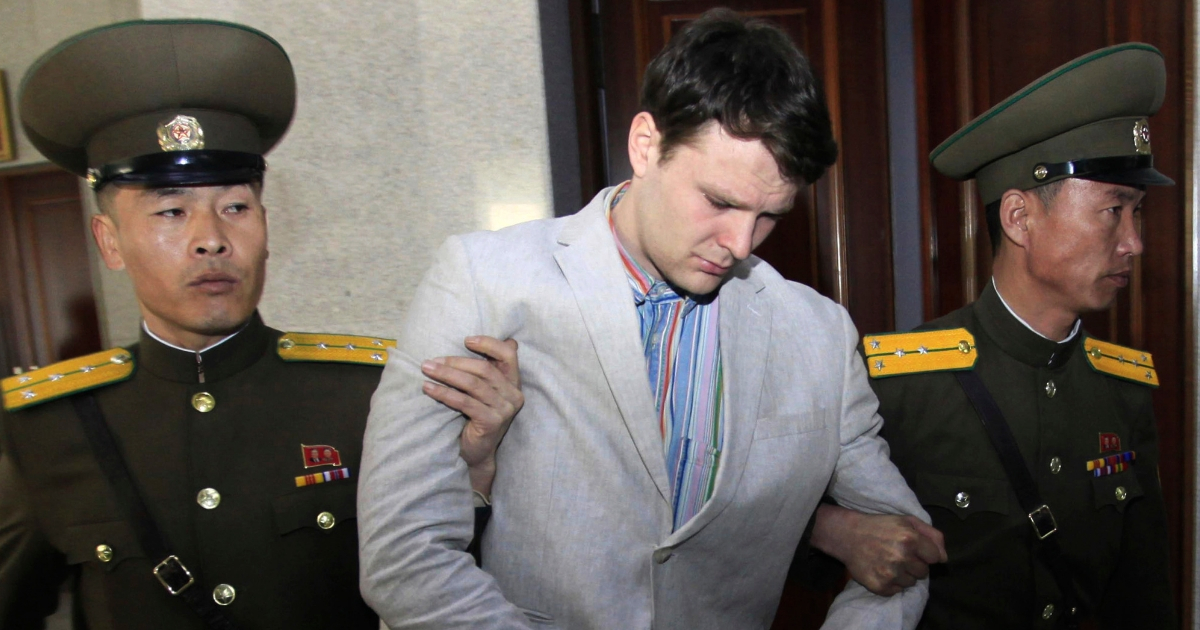 In this March 16, 2016, photo, American student Otto Warmbier is escorted at the Supreme Court in Pyongyang, North Korea.