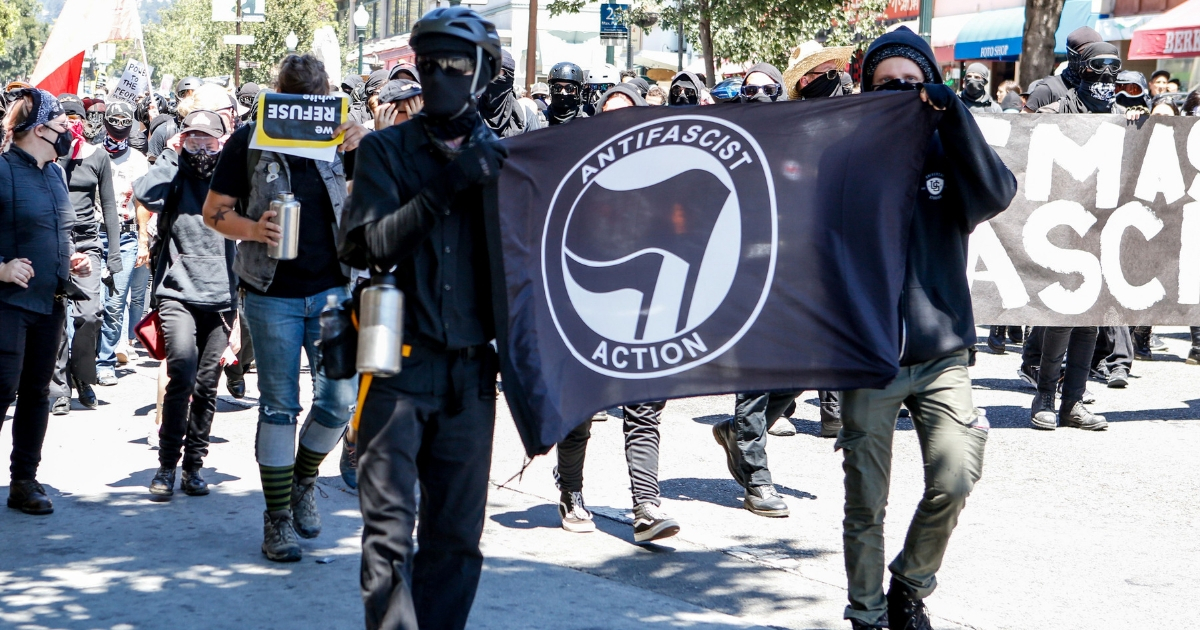Antifa militants march with counter protesters, as they protest an alt-right rally on Aug. 5, 2018, in downtown Berkeley, California.