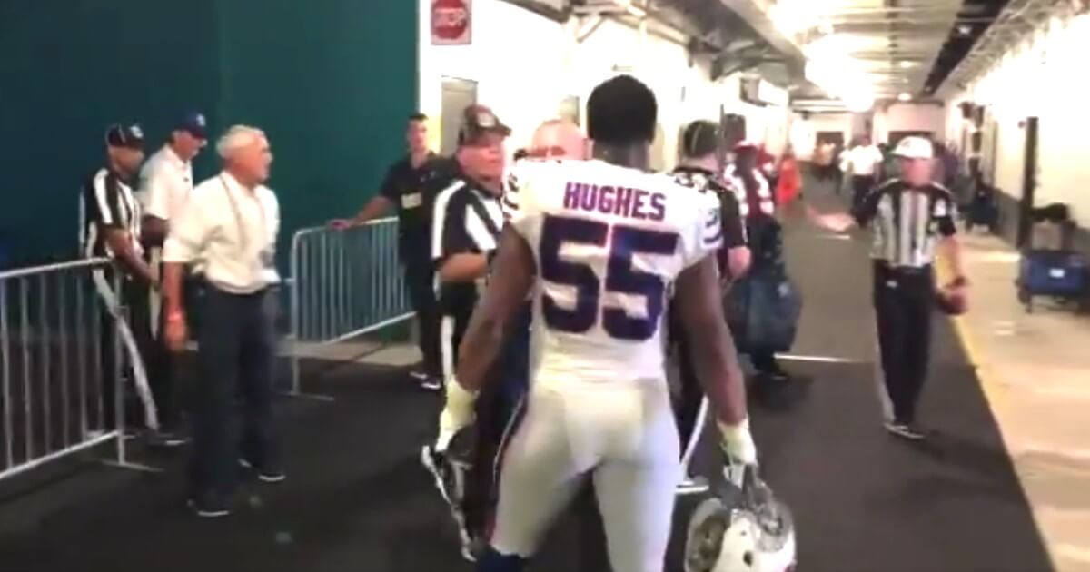 Buffalo Bills defensive end Jerry Hughes confronts a referee in the tunnel Sunday.