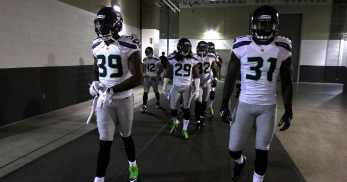 Cornerback Brandon Browner (39) and strong safety Kam Chancellor (31) of the Seattle Seahawks walk onto the field before the 2012 season opener against the Arizona Cardinals.