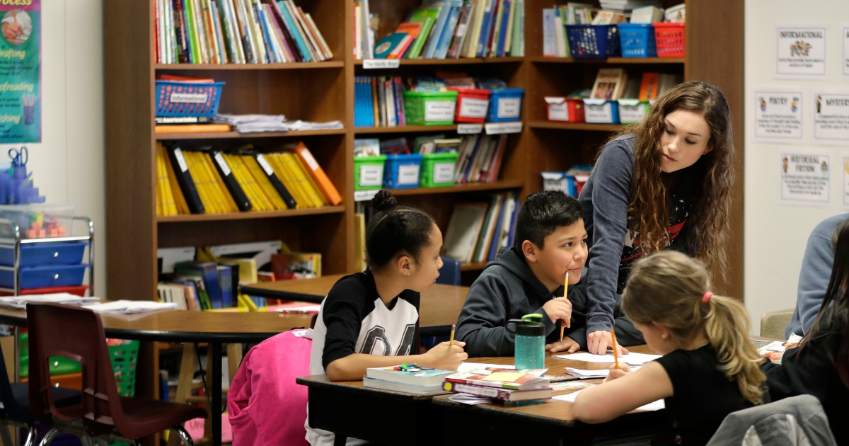 Chelsea Duvenez works with students in her fourth-grade classroom at Olympic View Elementary School on March 9, 2018, in Lacey, Washington.