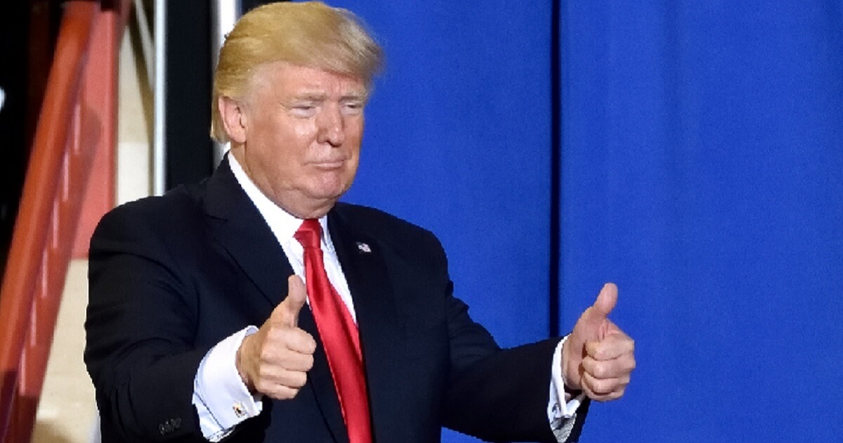 President Donald Trump gives two thumbs up to his audience as he leaves the stage of a campaign rally in April in Harrisburg, Pennsylvania.
