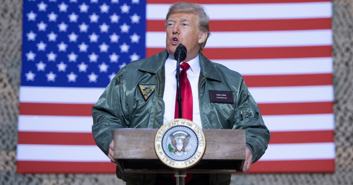 President Donald Trump speaks to members of the U.S. military during an unannounced trip to Al Asad Air Base in Iraq, Dec. 26, 2018.
