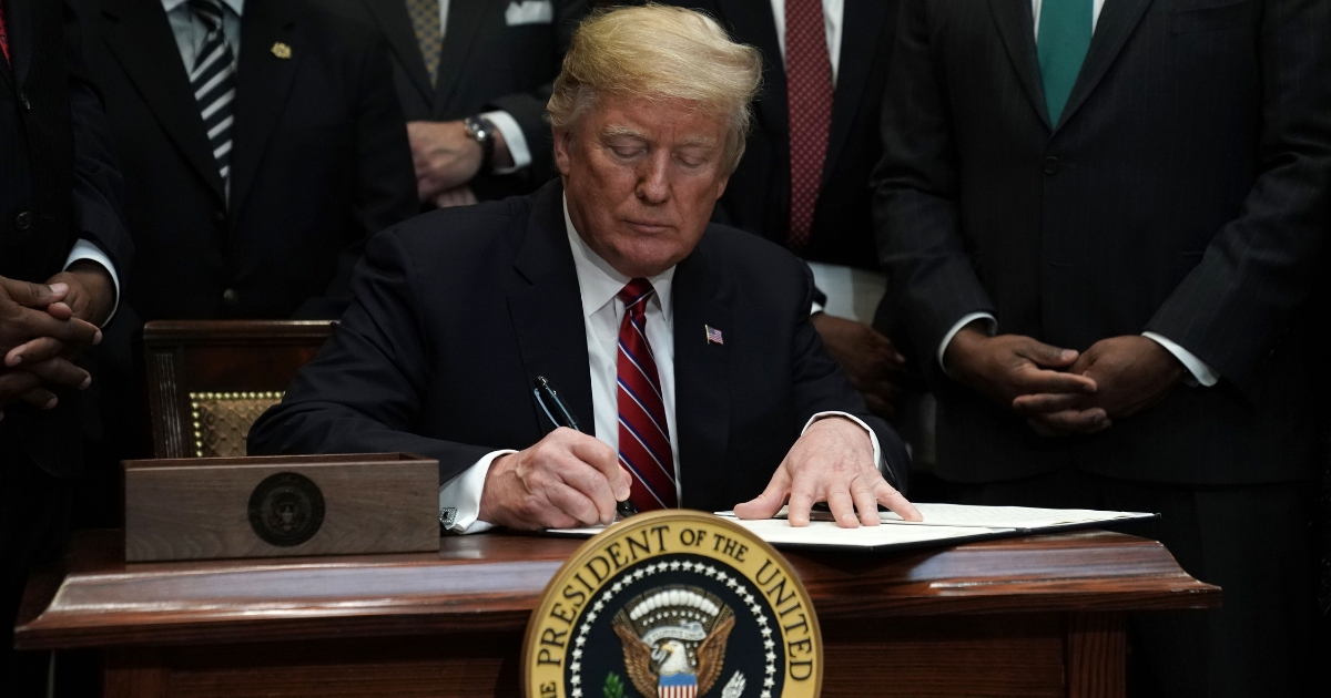 President Donald Trump participates in signing an executive order to establish the White House Opportunity and Revitalization Council Dec. 12, 2018, at the Roosevelt Room of the White House in Washington, D.C.
