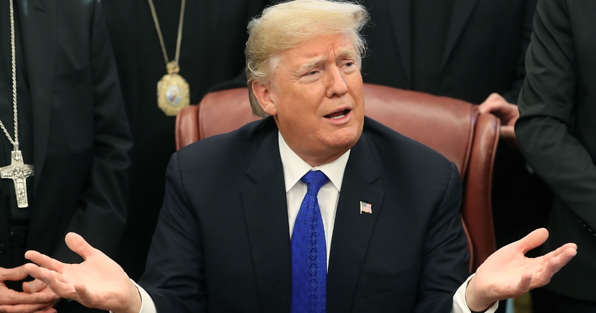 U.S. President Donald Trump speaks after signing H.R. 390, the 'Iraq and Syria Genocide Relief and Accountability Act of 2018' in the Oval Office at the White House on Dec. 11, 2018.