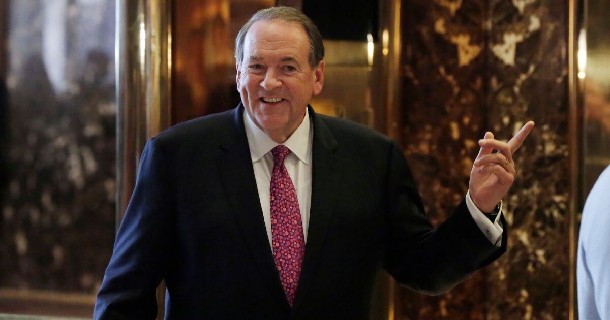 Former Arkansas Gov. Mike Huckabee waits for the elevator at Trump Tower in New York on Nov. 18, 2016.