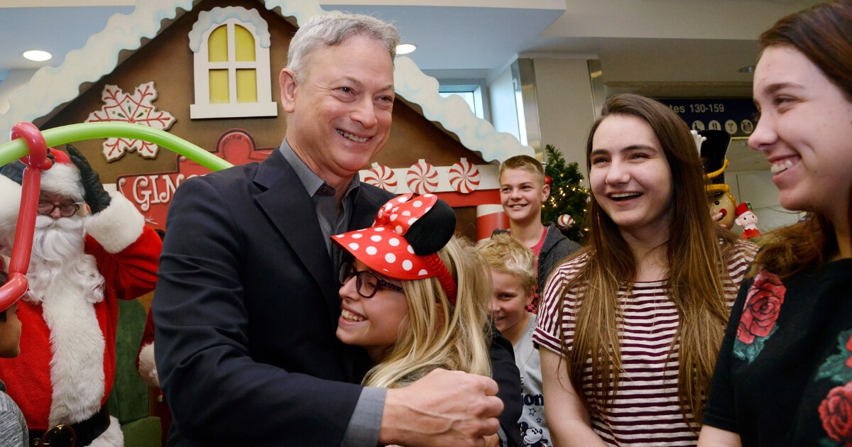 Actor/humanitarian Gary Sinise meets with Gold Star families at the Gary Sinise Foundation's Snowball Express Send-Off Celebration at LAX Airport on Dec. 8.