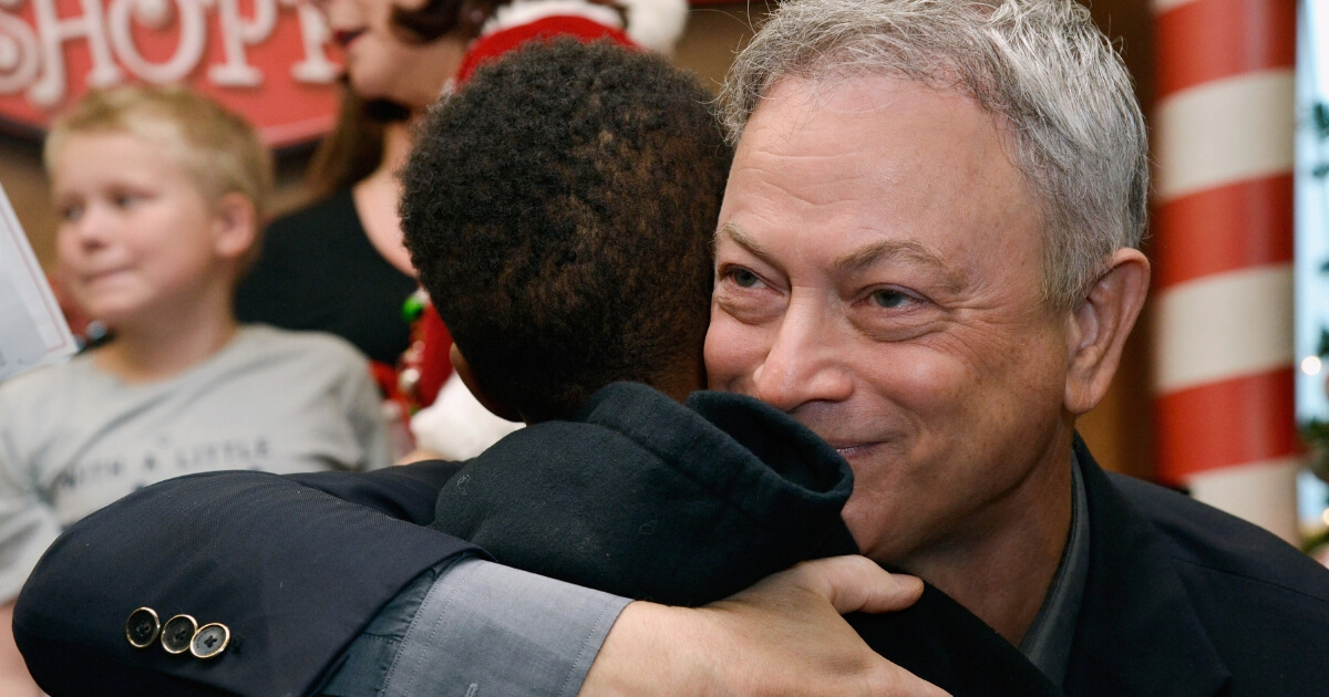 Actor Gary Sinise meets with Gold Star families at the Gary Sinise Foundation's Snowball Express Send-Off Celebration at LAX Airport on Saturday.
