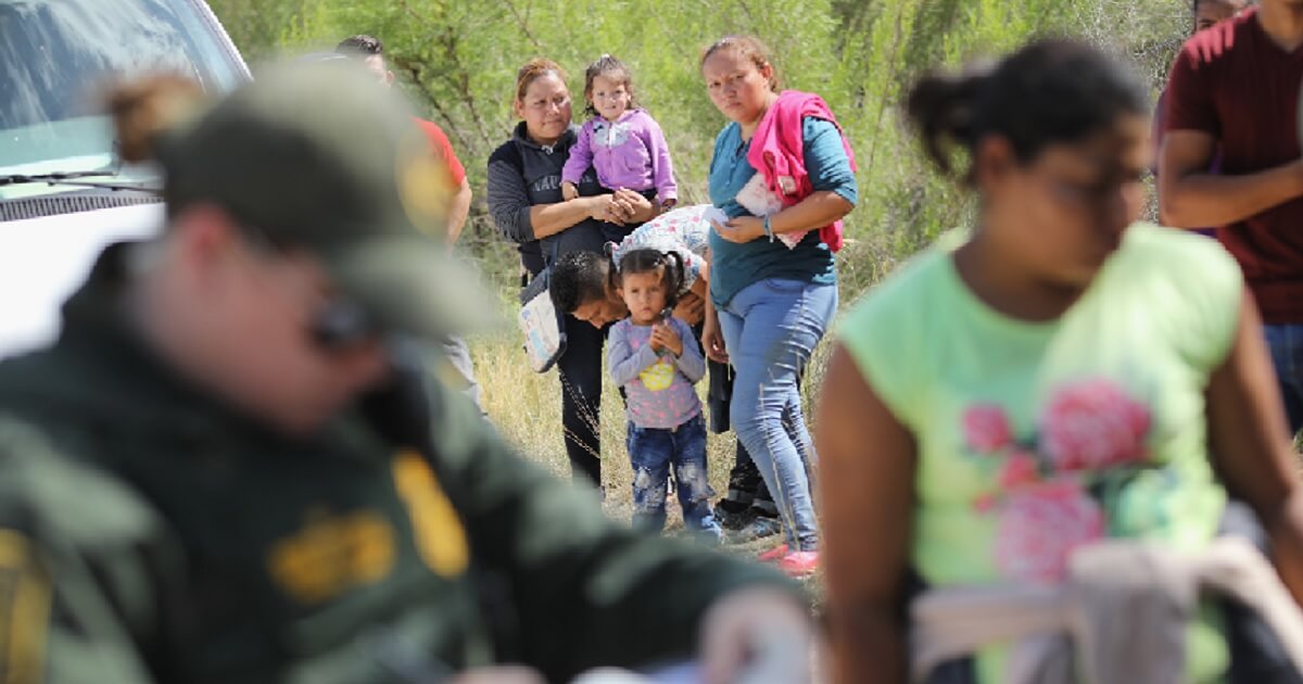 Illegal immigrants from Central America are detained by Border Patrol agents in a June file photo.