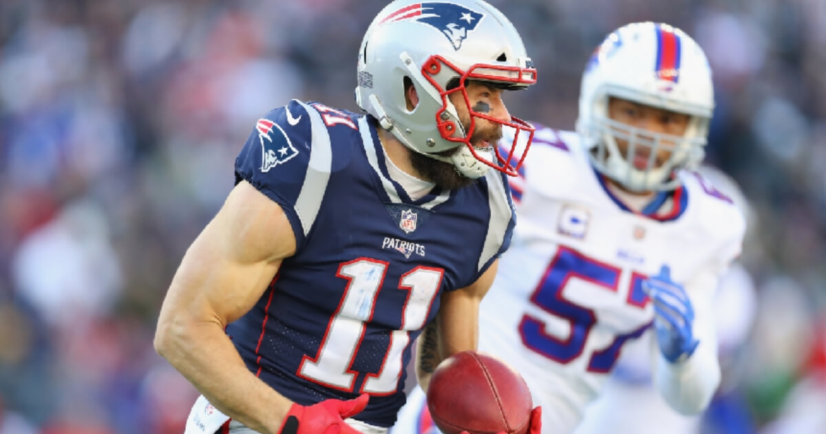 Julian Edelman #11 of the New England Patriots runs with the ball during the first half against the Buffalo Bills at Gillette Stadium on Dec. 23, 2018 in Foxborough, Massachusetts.