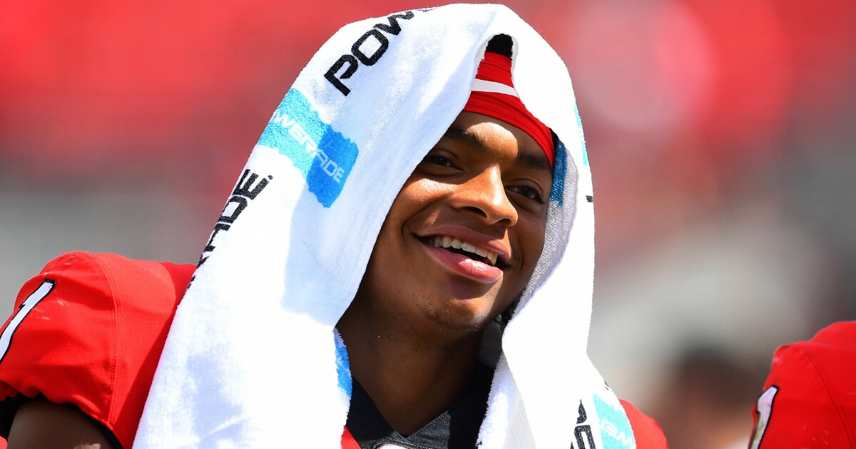Justin Fields of the Georgia Bulldogs smiles as he leaves the field after the Sept. 15 game against Middle Tennessee in Athens.