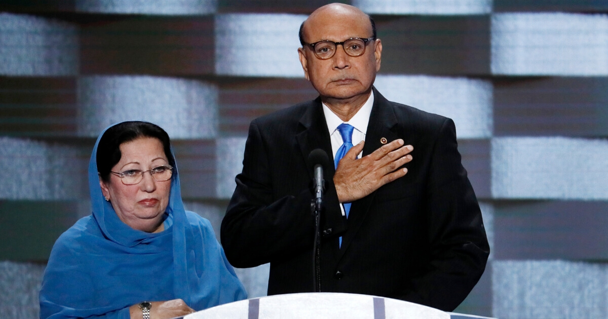 In this July 28, 2016, photo, Khizr Khan, father of fallen Army Capt. Humayun Khan and his wife Ghazala speak during the final day of the Democratic National Convention in Philadelphia.
