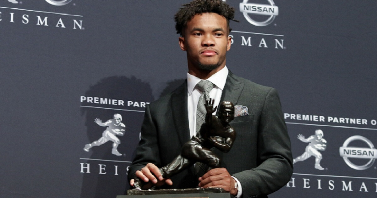Oklahoma Sooners quarterback Kyler Murray poses with the Heisman Trophy he was awarded on Dec. 8 in New York City.